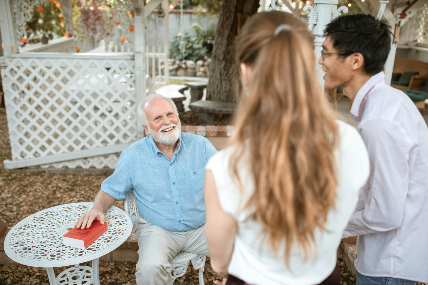 Family visiting senior in nursing home